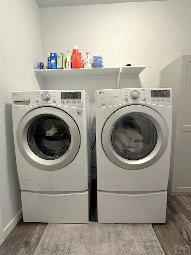 4805 Walking Stick Blvd, Pueblo, CO 81001 - laundry area with independent washer and dryer, wood finished floors, and baseboards