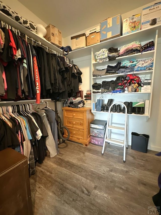 4805 Walking Stick Blvd, Pueblo, CO 81001 - walk in closet featuring wood finished floors