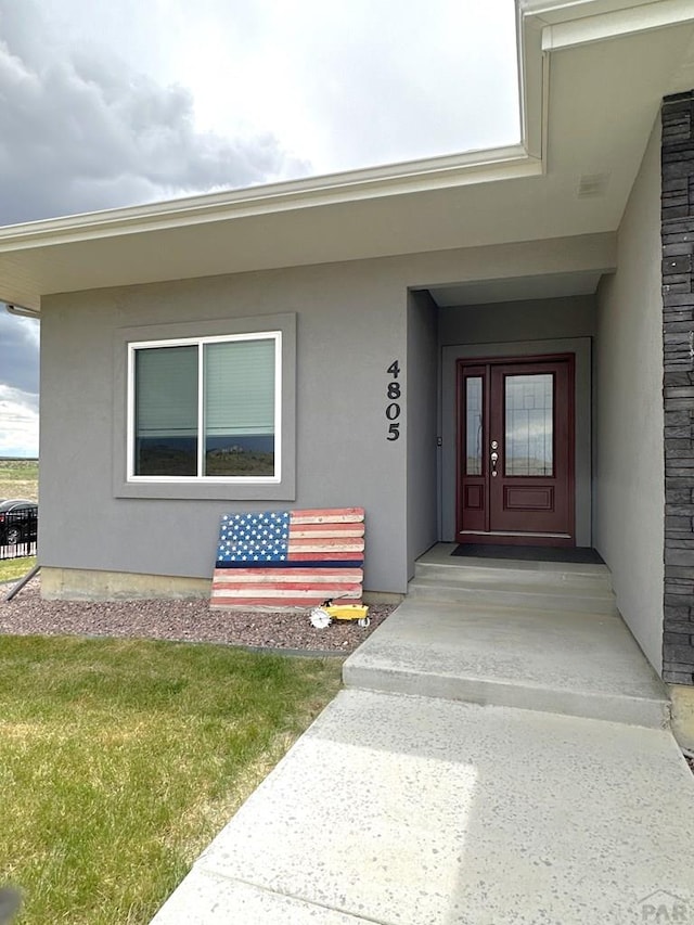 4805 Walking Stick Blvd, Pueblo, CO 81001 - view of exterior entry with stucco siding