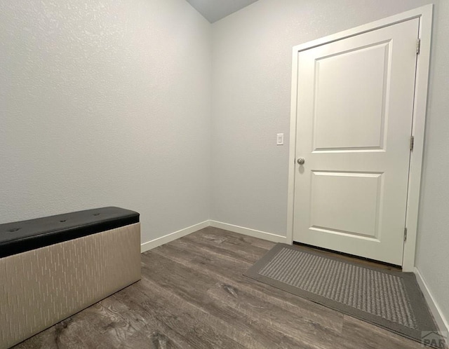4805 Walking Stick Blvd, Pueblo, CO 81001 - laundry area with dark wood finished floors and baseboards