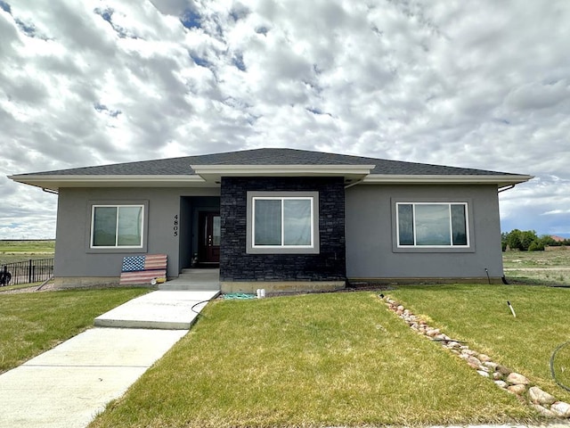4805 Walking Stick Blvd, Pueblo, CO 81001 - view of front of home featuring stucco siding and stone siding
