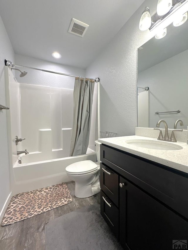 4805 Walking Stick Blvd, Pueblo, CO 81001 - bathroom featuring shower / tub combo with curtain, toilet, vanity, and wood finished floors