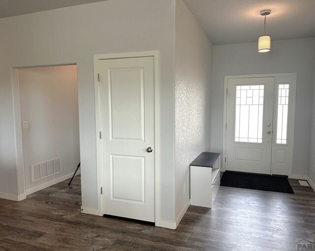 4805 Walking Stick Blvd, Pueblo, CO 81001 - entrance foyer featuring dark wood finished floors and baseboards