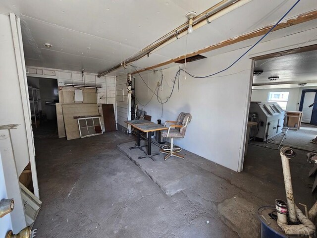 dining area featuring unfinished concrete floors