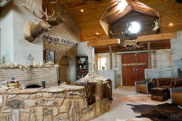 interior space with high vaulted ceiling and wooden ceiling