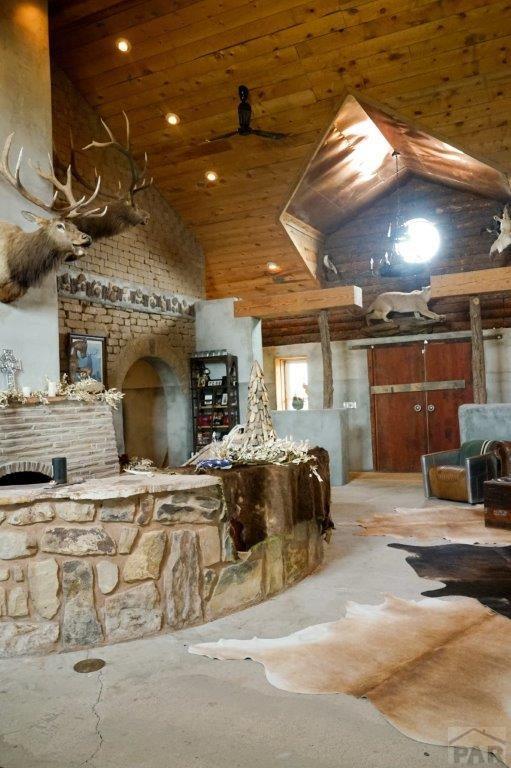 kitchen featuring high vaulted ceiling and wooden ceiling