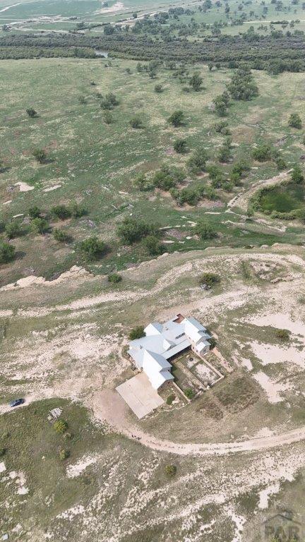 birds eye view of property with a rural view