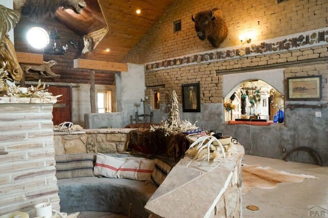 living room featuring visible vents and vaulted ceiling