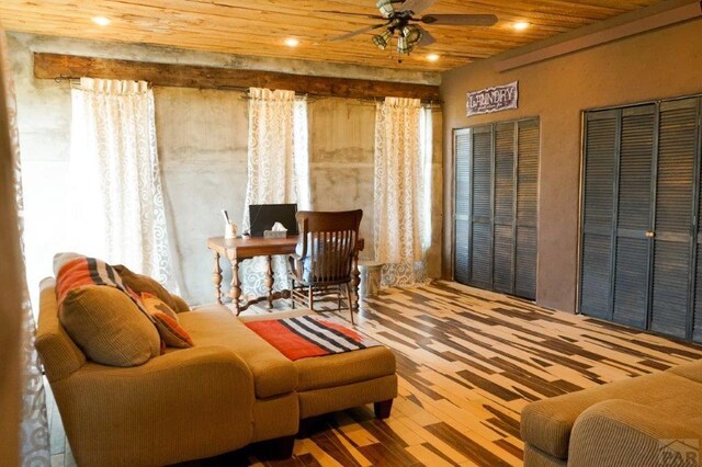 living area featuring recessed lighting, wood ceiling, and ceiling fan