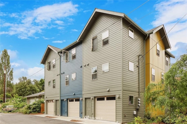 view of side of property featuring a garage