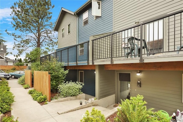 view of side of property featuring a balcony