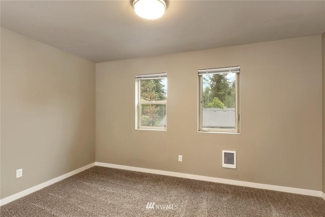 view of carpeted spare room