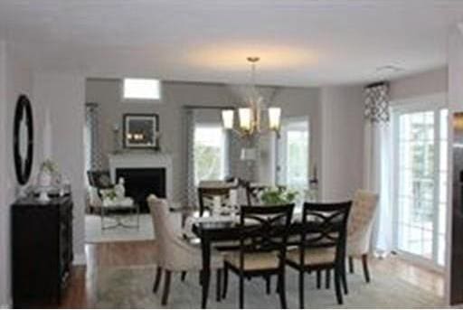 dining space featuring a healthy amount of sunlight and a notable chandelier